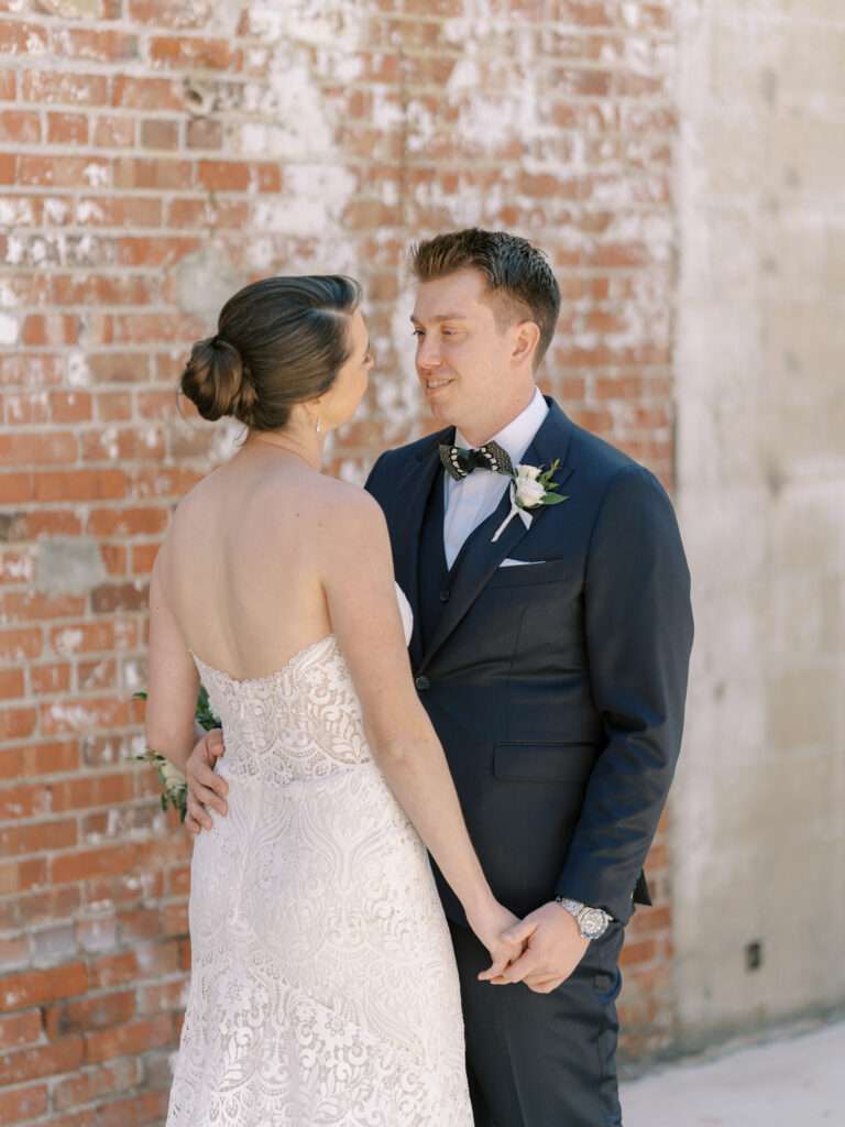 Bride and Groom first look at Strongwater Events from an early spring in downtown Columbus, Ohio with Kelly & Sean