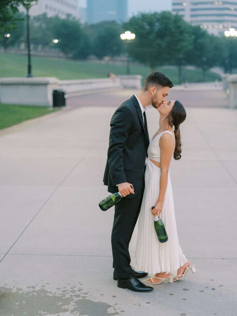 Spraying champagne along the Scioto Mile following Ana & Stephen's engagement session in downtown Columbus