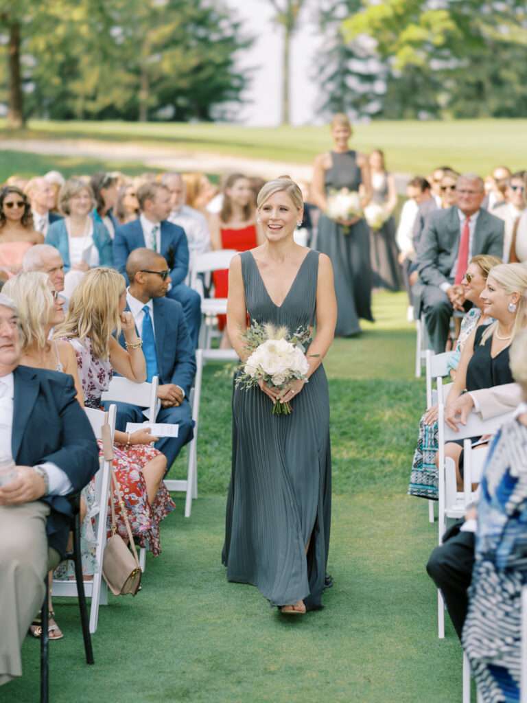 An outdoor wedding ceremony on the tenth green at Kirtland Country Club