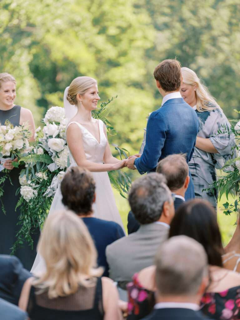 An outdoor wedding ceremony on the tenth green at Kirtland Country Club