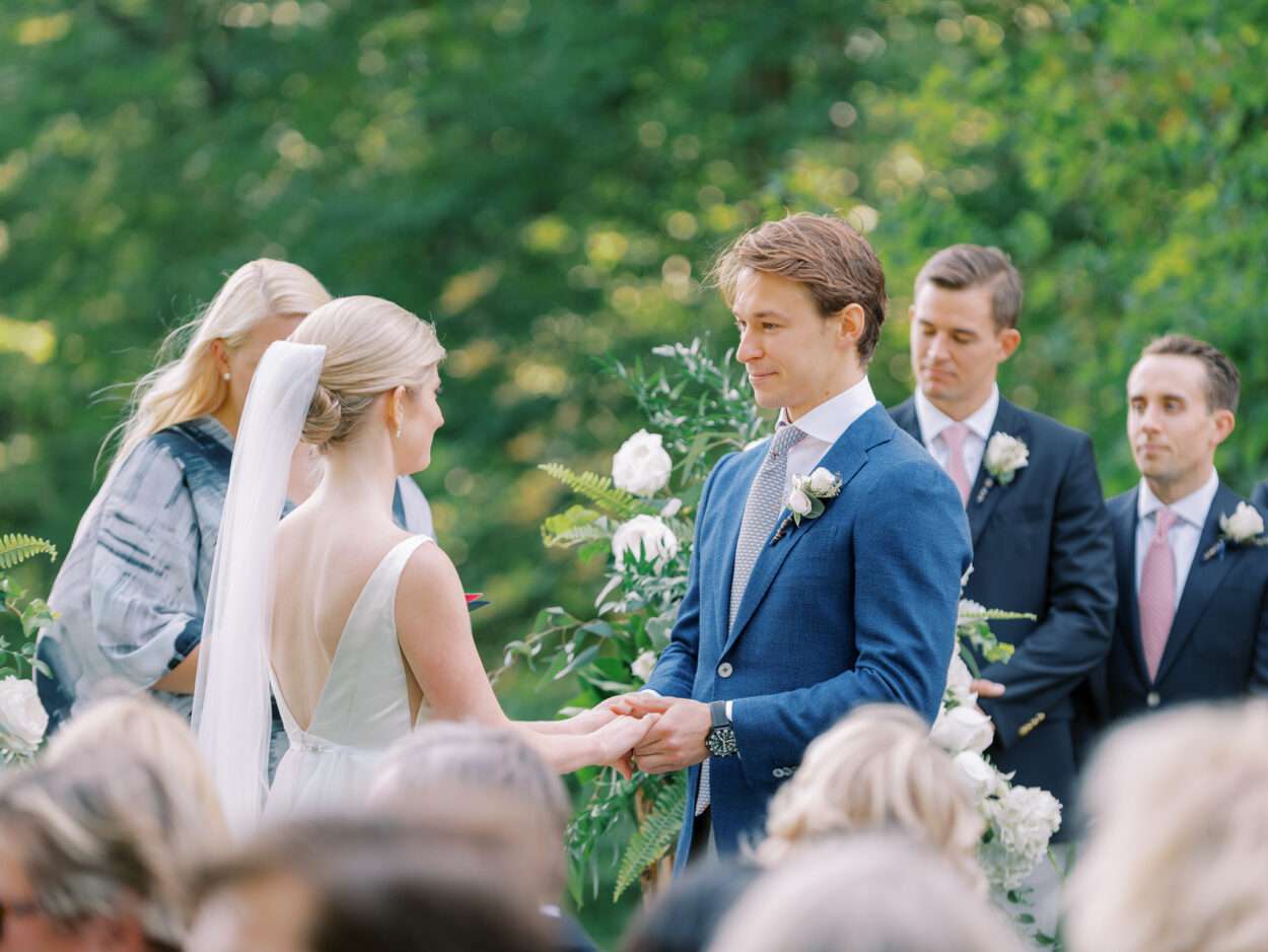 An outdoor wedding ceremony on the tenth green at Kirtland Country Club